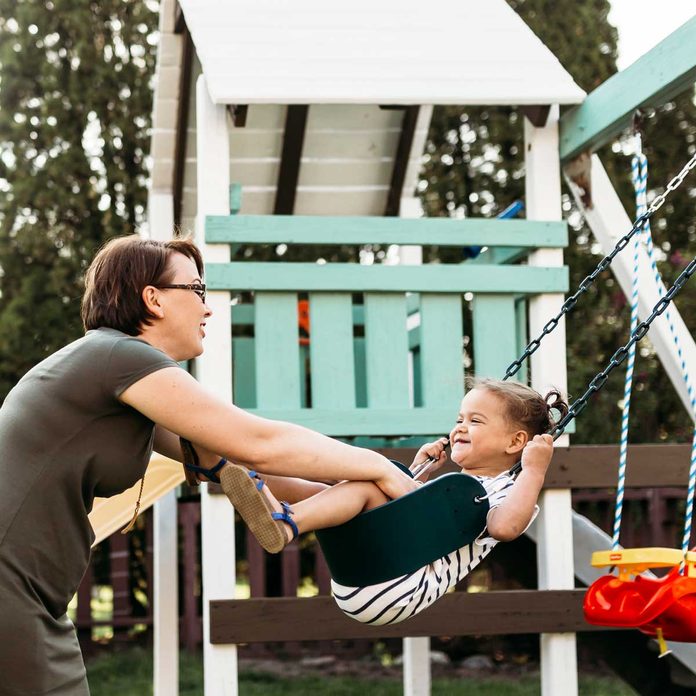Playing On Swing Set Gettyimages 961332858