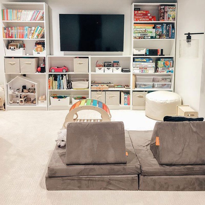 Shelving insert with a television in a carpeted basement