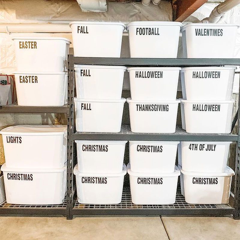 functional basement shelving with white bins for storage