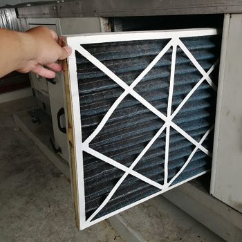 closeup of taking out furnace filter