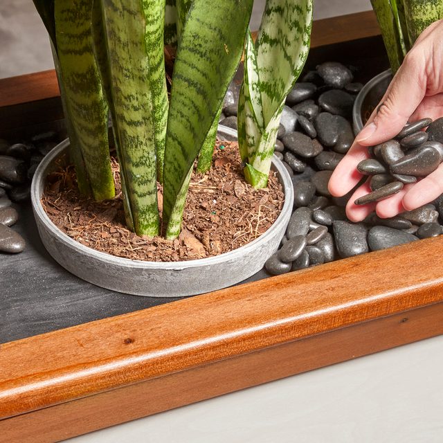 Filling the planter with river rock