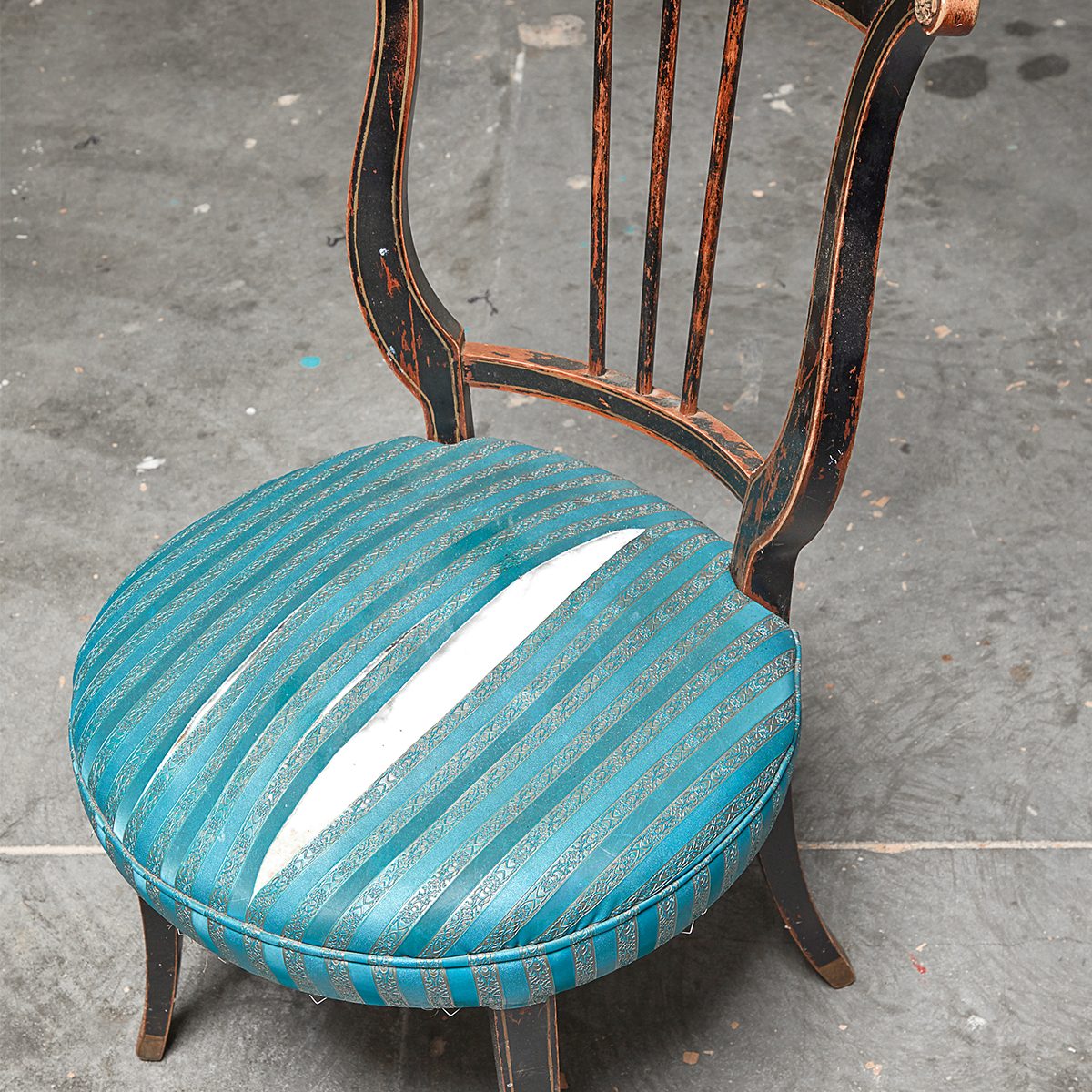 chair with ripped fabric