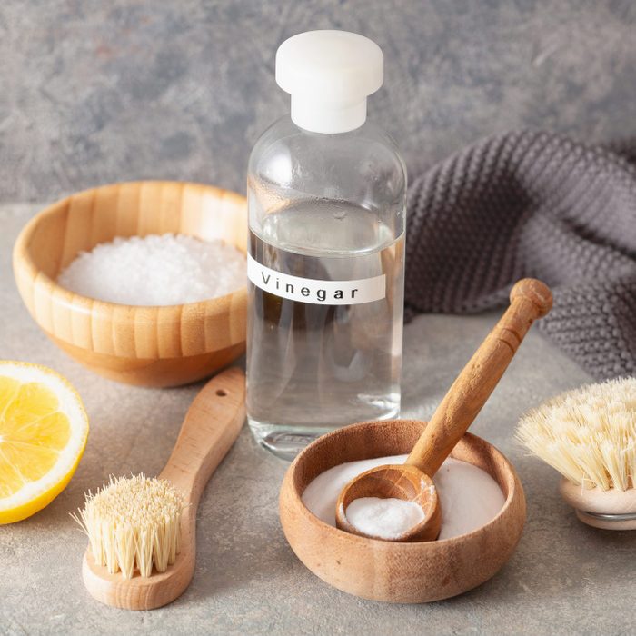 zero waste eco friendly cleaning concept. wooden brushes, lemon, baking soda, vinegar