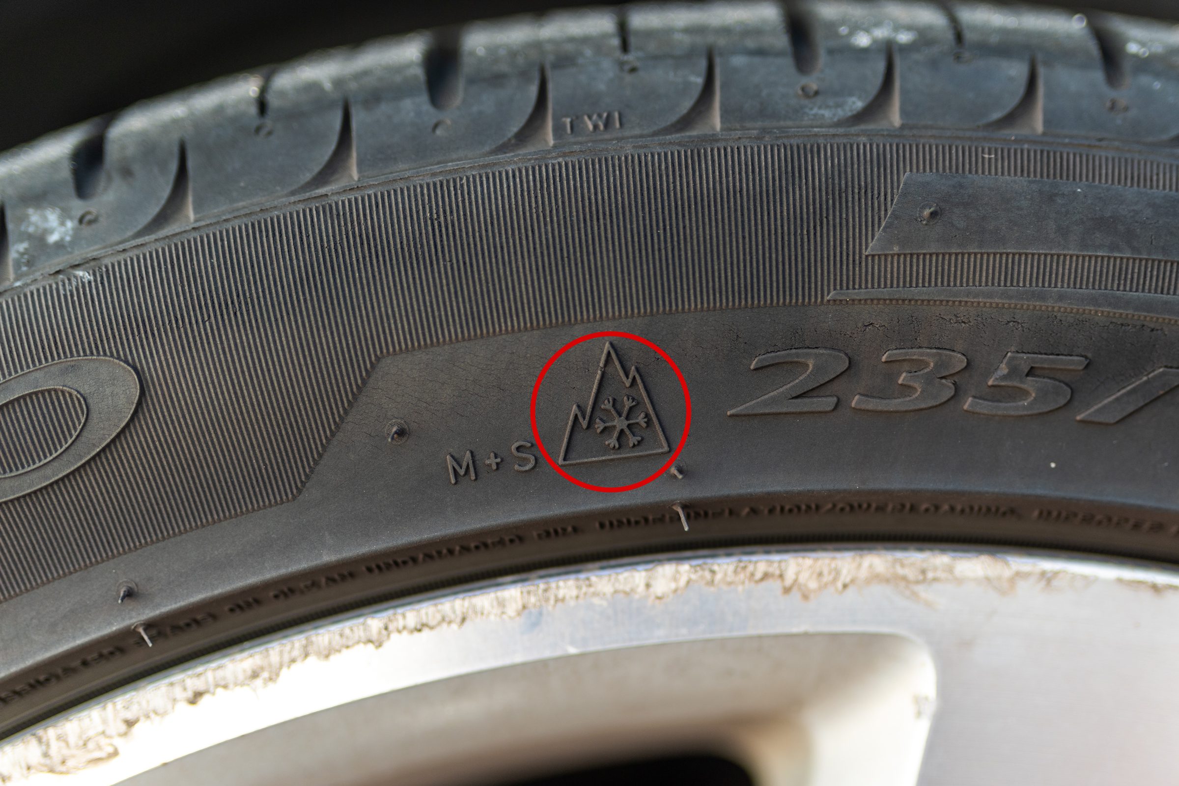 Close up of 3 Peak Mountain Snowflake Tire Symbol