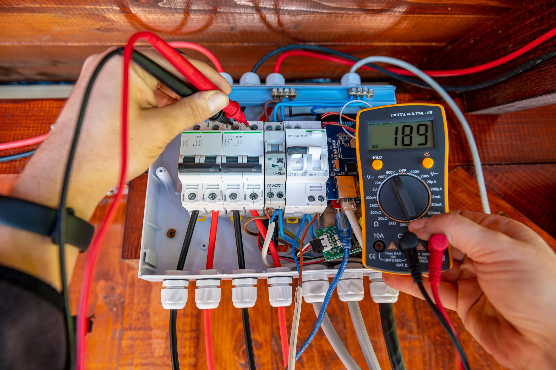 electrician using multimeter