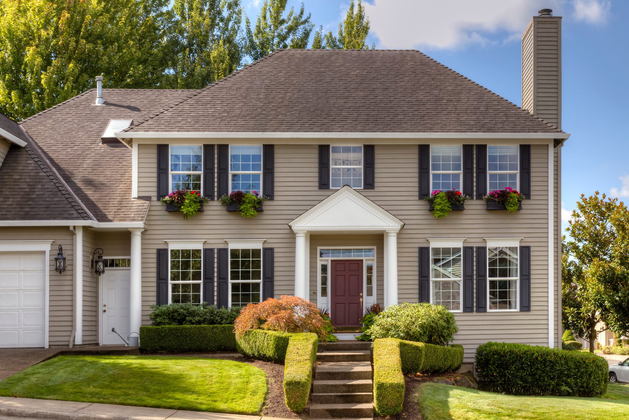 Traditional style home with window shutters