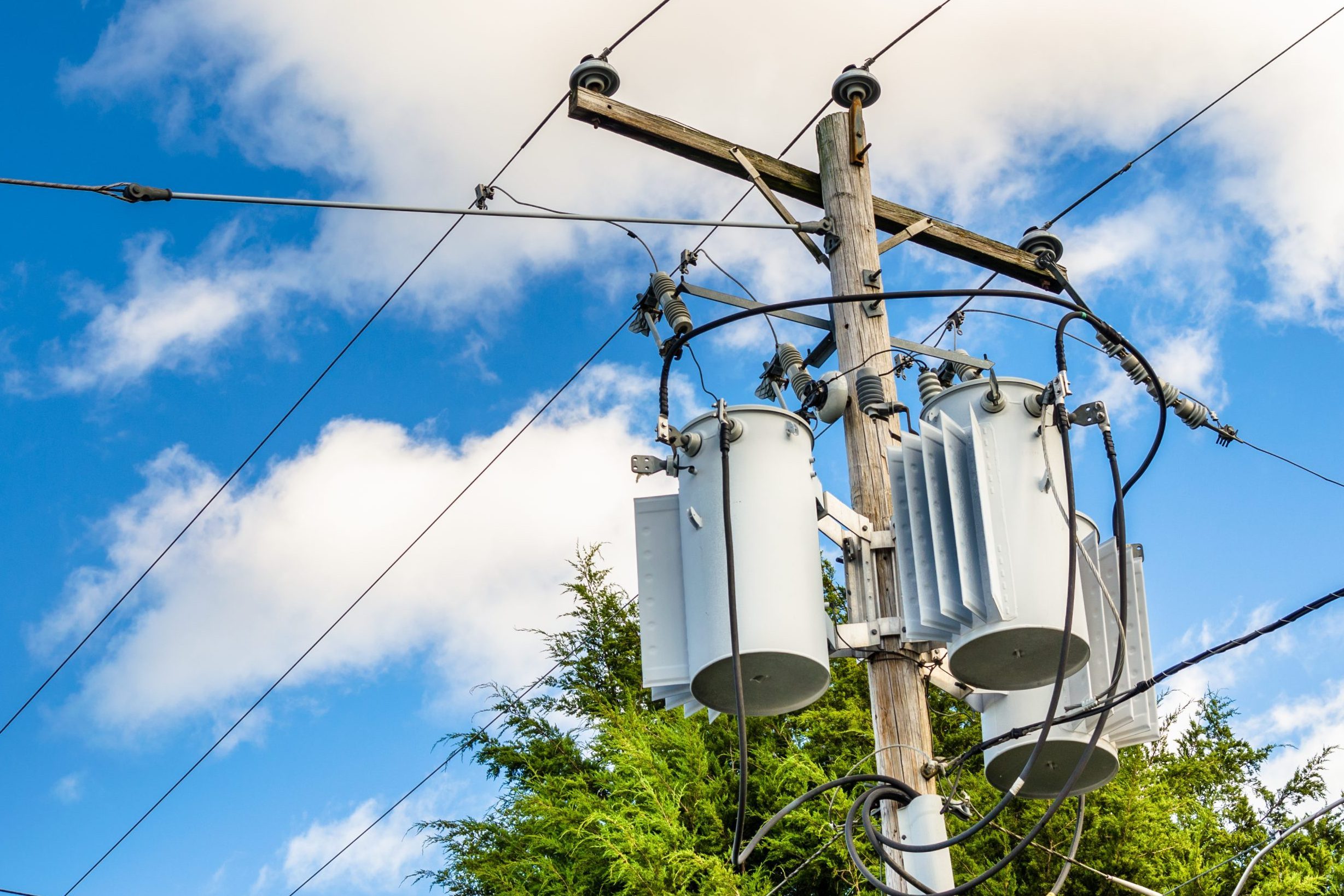 Electricity Pole with Transformers and Blue Sky