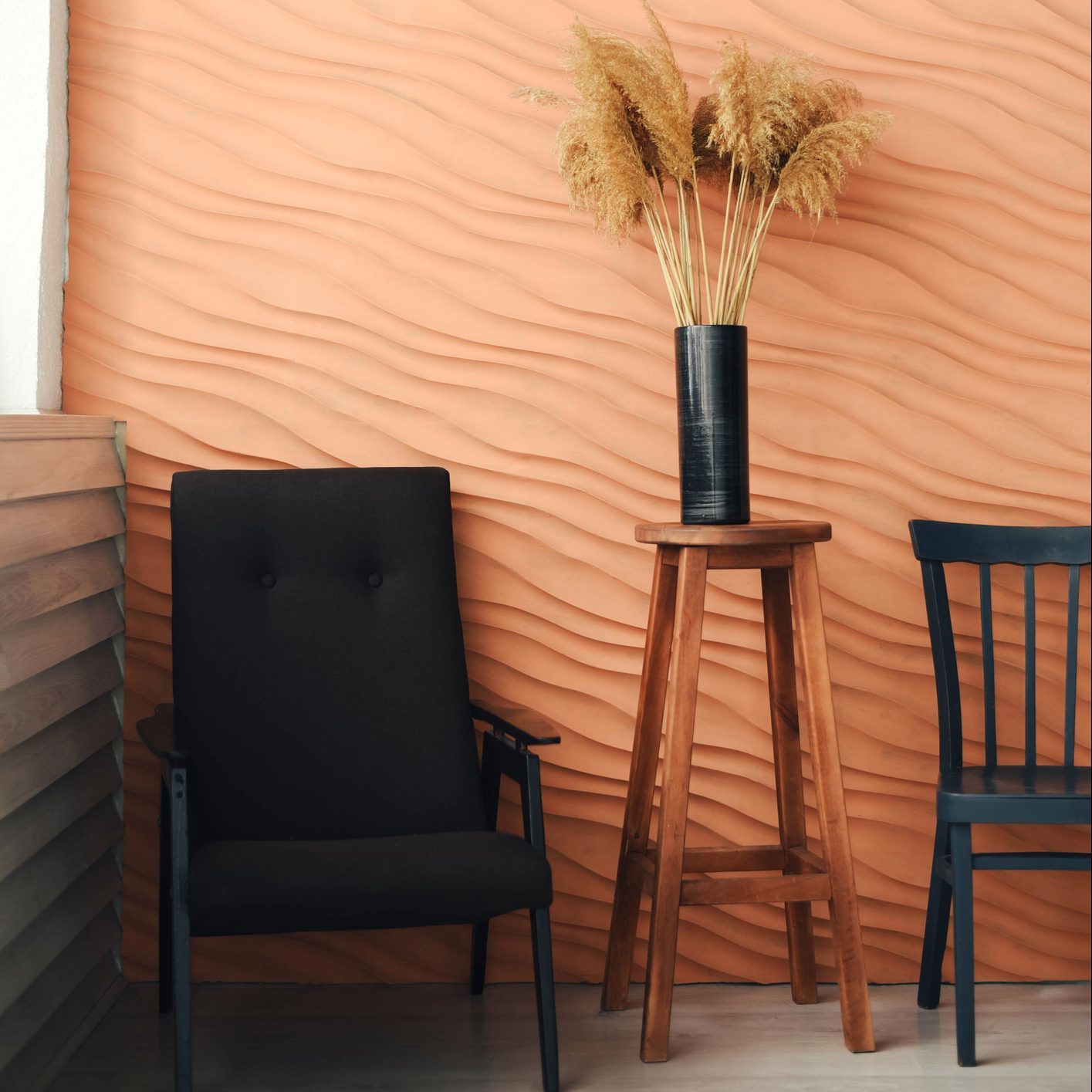 A vase with reeds in a stylish interior.