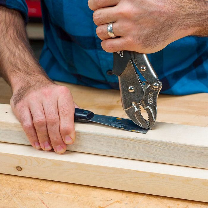 man using Vise-Grips pliers To Pull Nails Pliers Trick