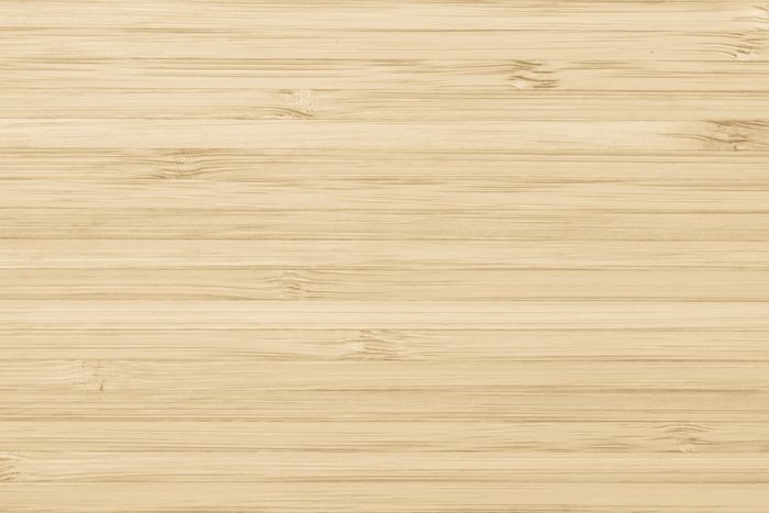Bamboo wood texture background in natural light yellow cream color