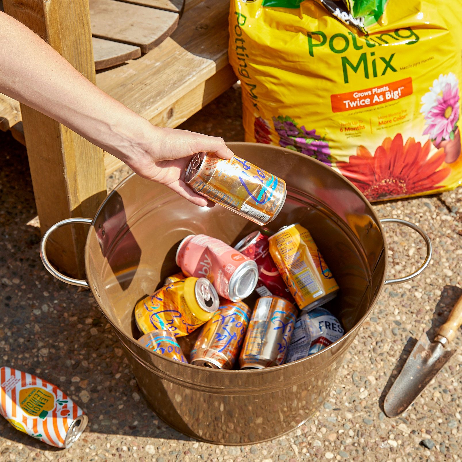 bottom of a planter filled with recycled cans