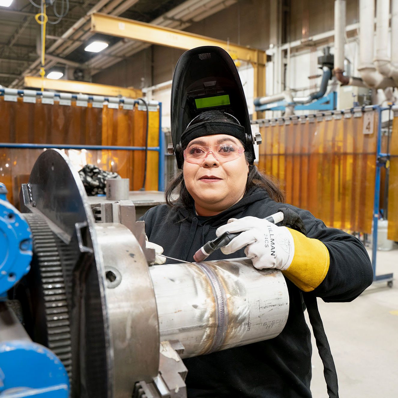 portrait of Celiareyes at work with welding mask