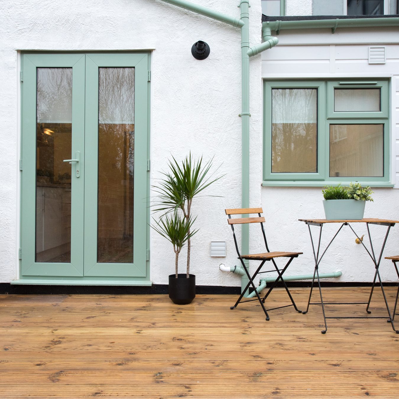 contemporary renovated house exterior with painted wood trim