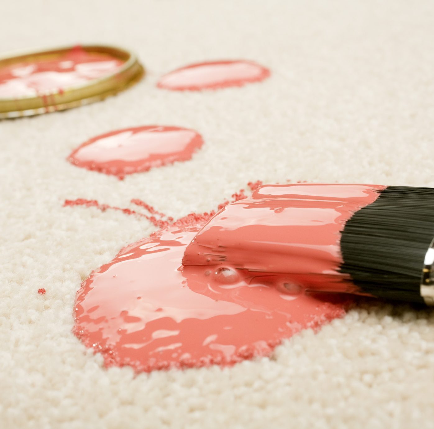 Spilled pink Paint with paint brush on Carpet