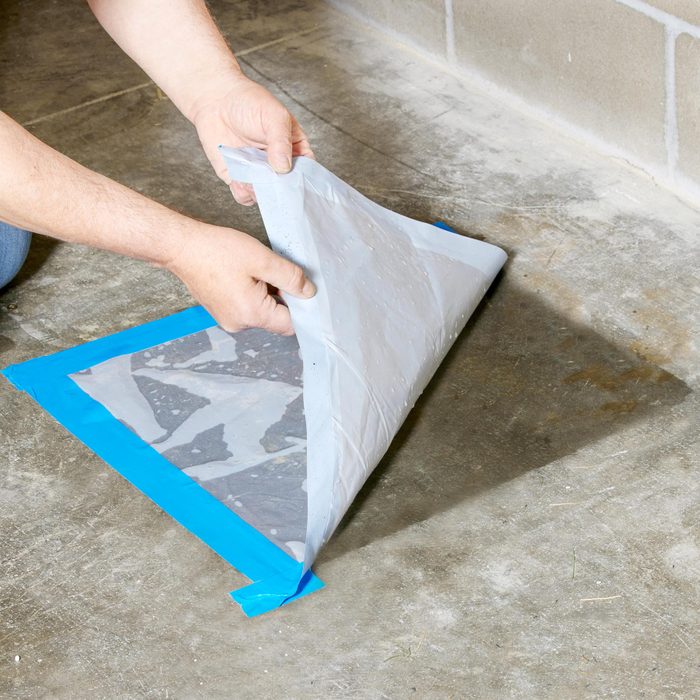 seeing if there is a moisture problem with a piece of plastic taped to the concrete floor