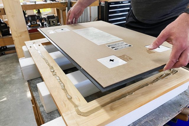 gluing the mirror to the frame