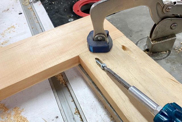 using a screwdriver to join the pieces together