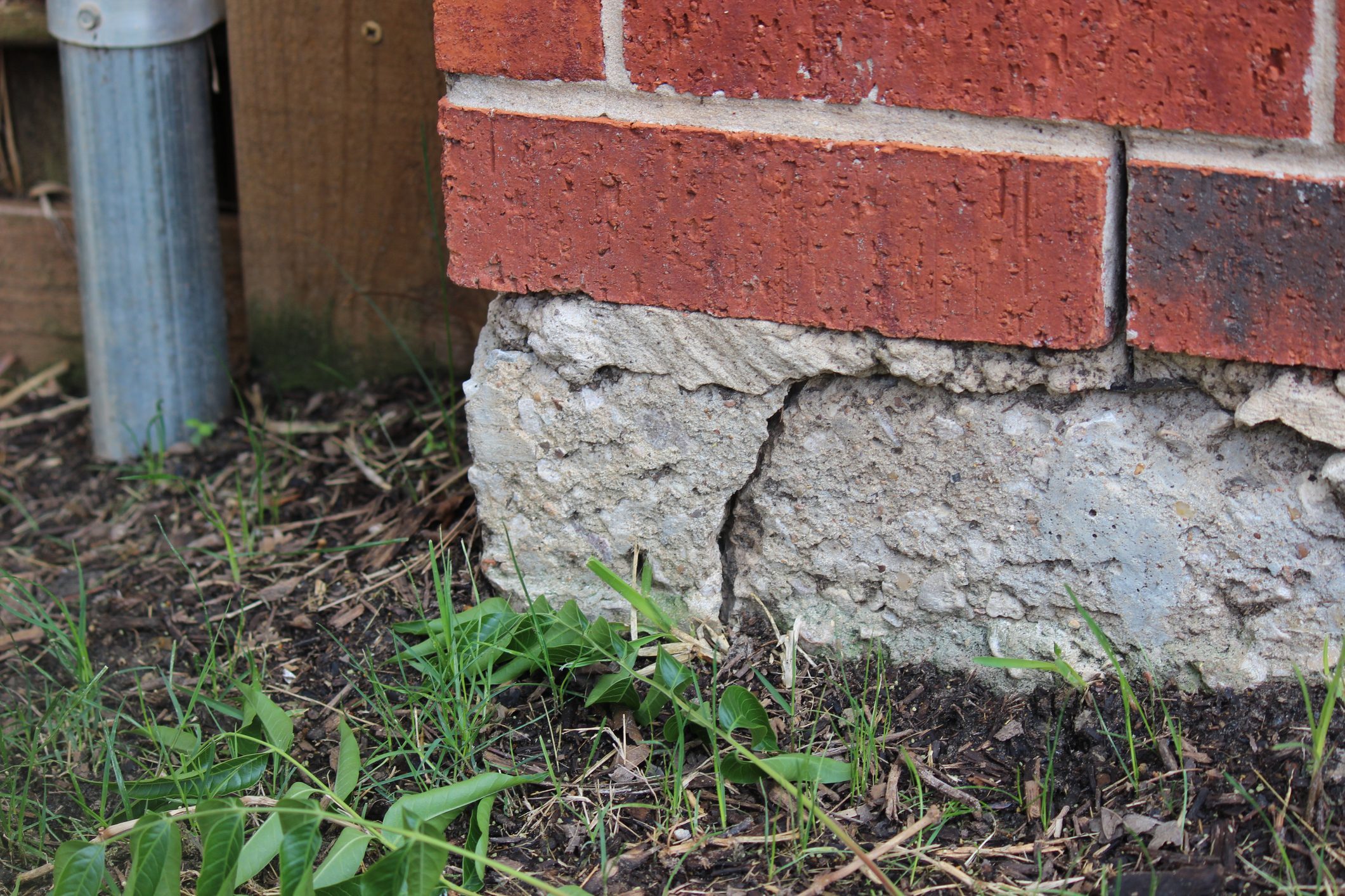 Crack in the wall joint of a home exterior indicating concrete slab foundation problem