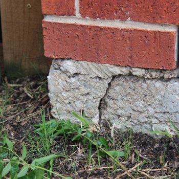 Crack in the wall joint of a home exterior indicating concrete slab foundation problem