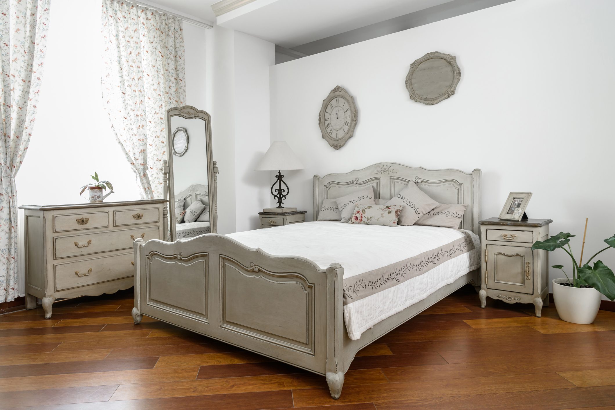 interior of modern light bedroom with white and grey furniture