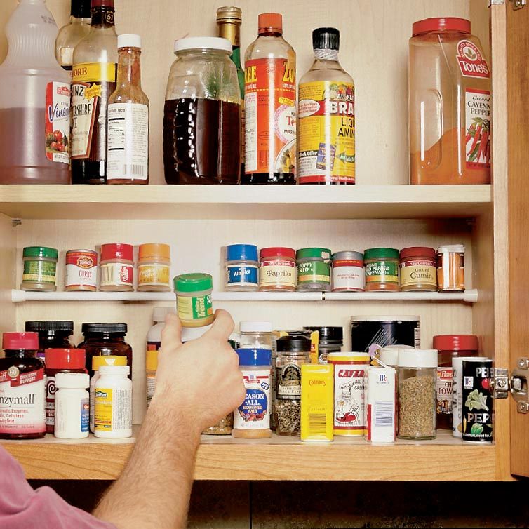 using a tension rod in a spice cupboard