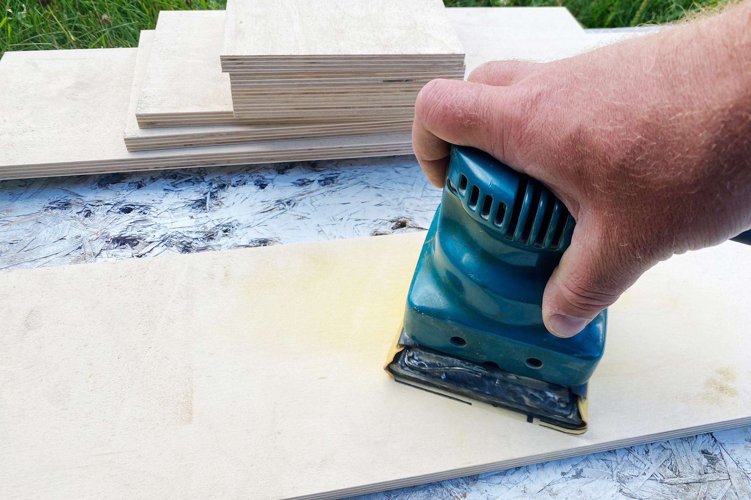 sand the corners of DIY drawer dividers