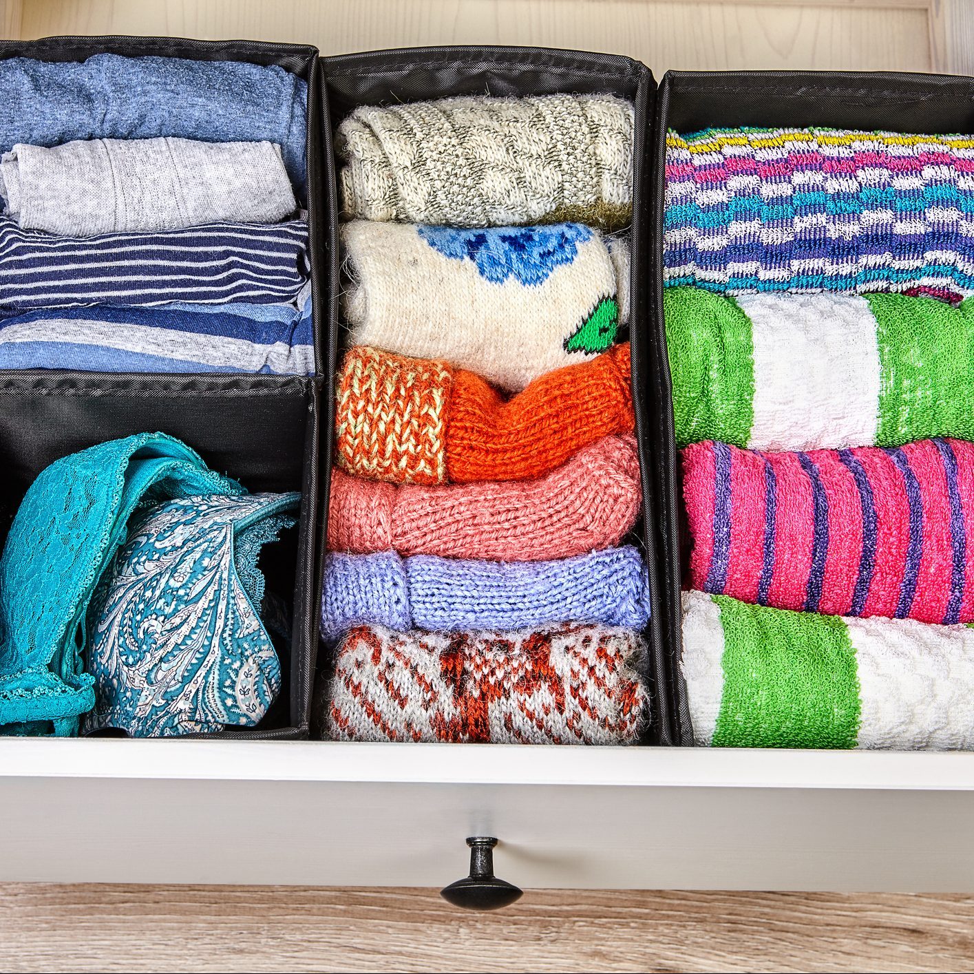 Boxes for separate storage of linen in a drawer.