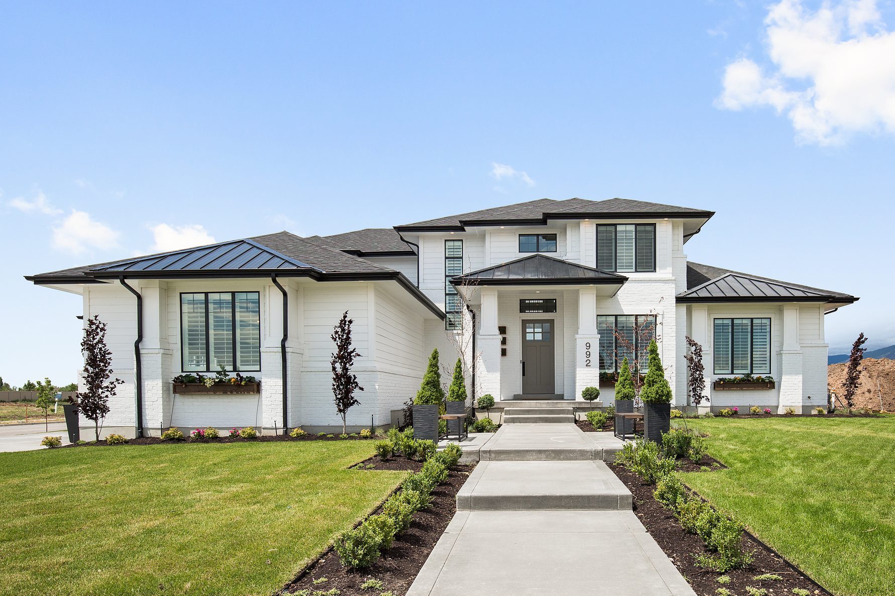 Front exterior of newly constructed modern white home