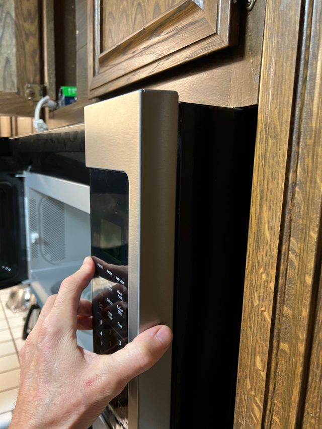 Attach microwave control panel