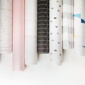rolls of wallpaper In a line