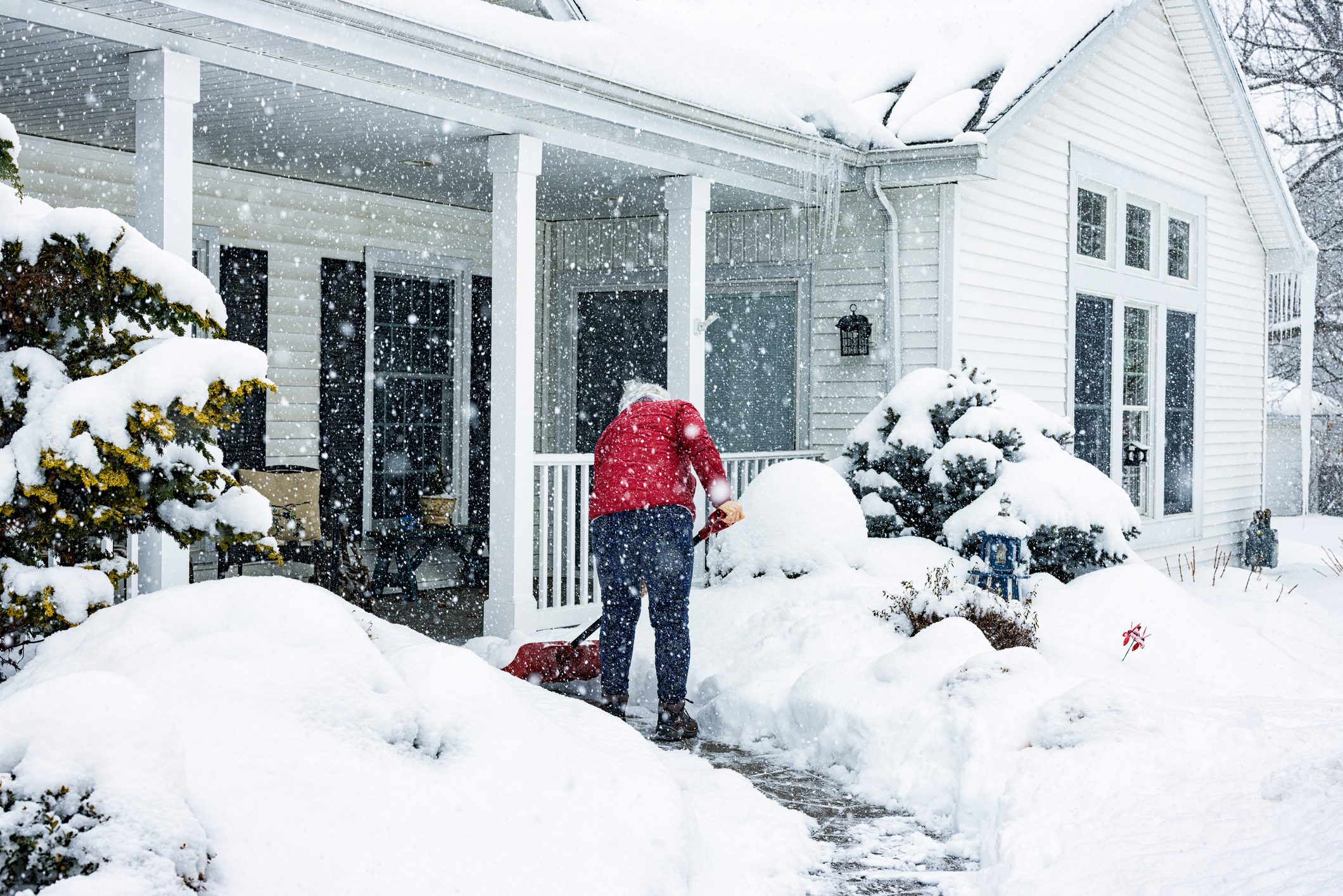 Red Jacket Woman Push Shoveling Winter Blizzard Snow