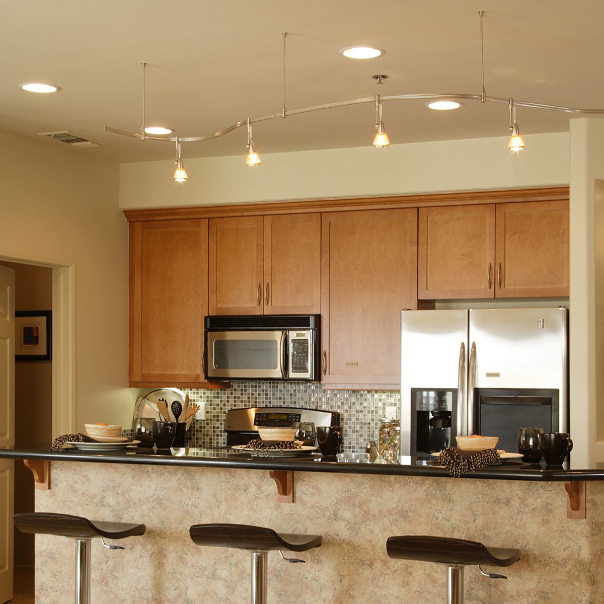 Gettyimages 522916880 Track Lighting In Kitchen By Scott Van Dyke