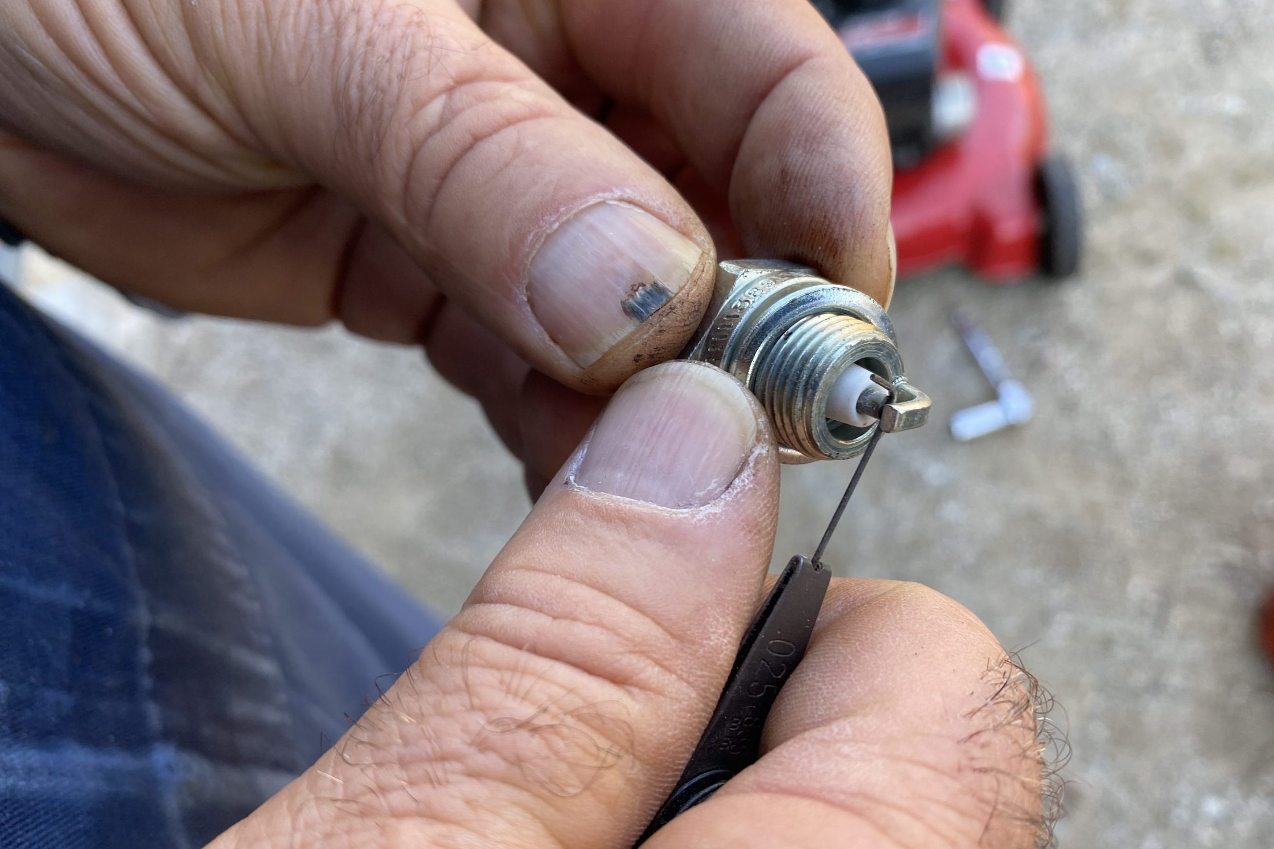 Inspect the new spark plug