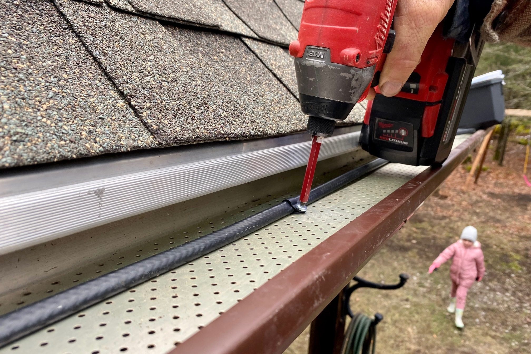 Route heating cable through gutters