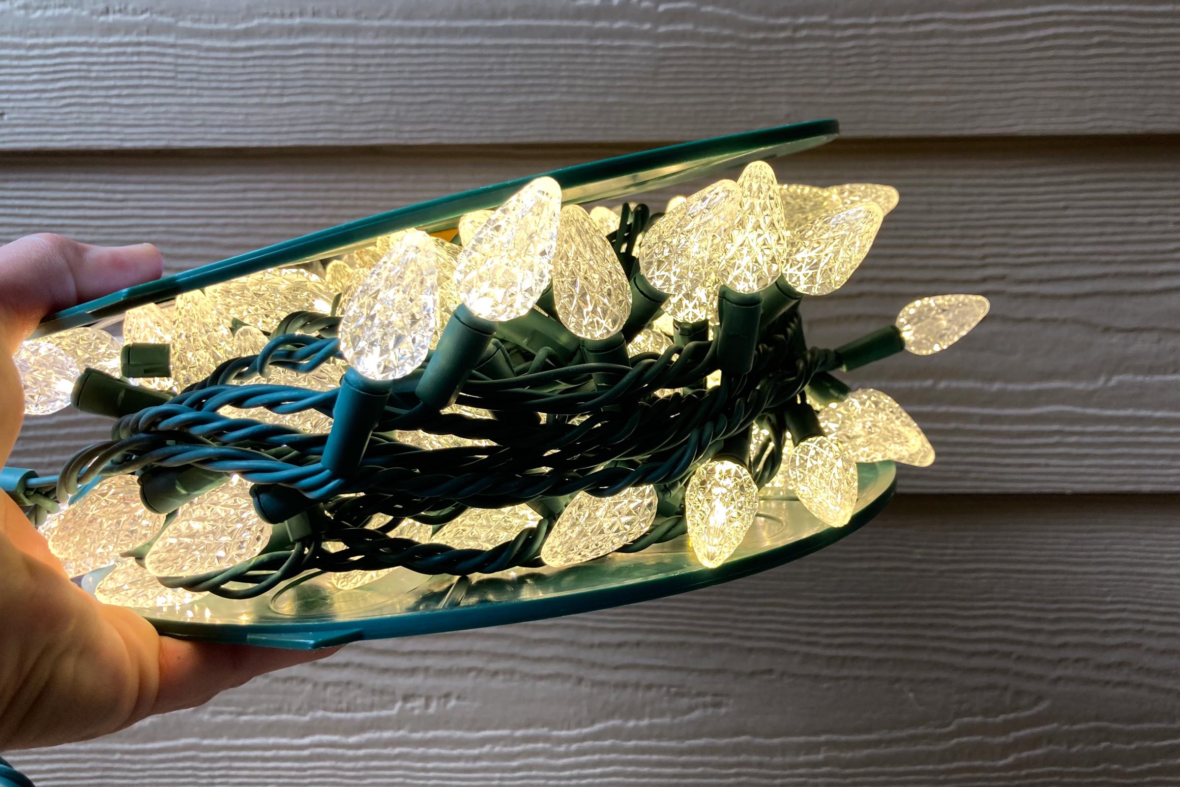 a spool of christmas lights glowing