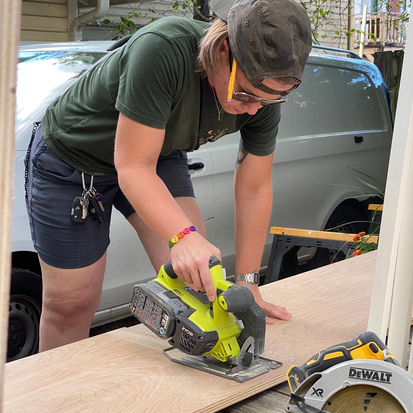 Kat using a saw and cutting wood