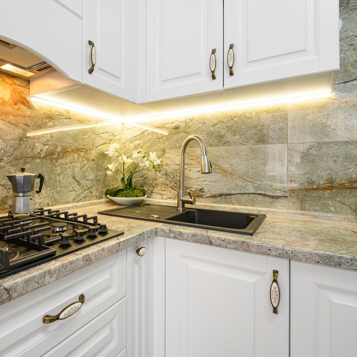 LED string lights under a kitchen cabinet