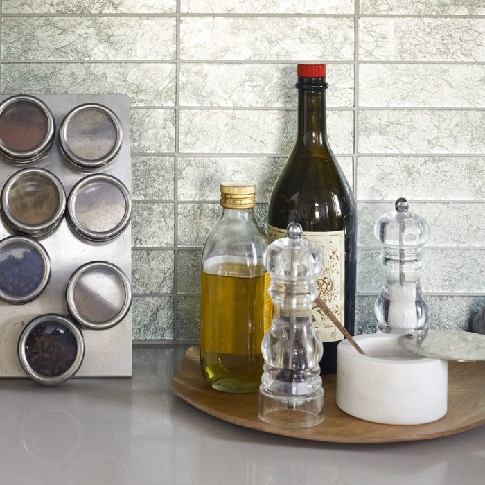 lazy susan with olive oil and spices on the counter