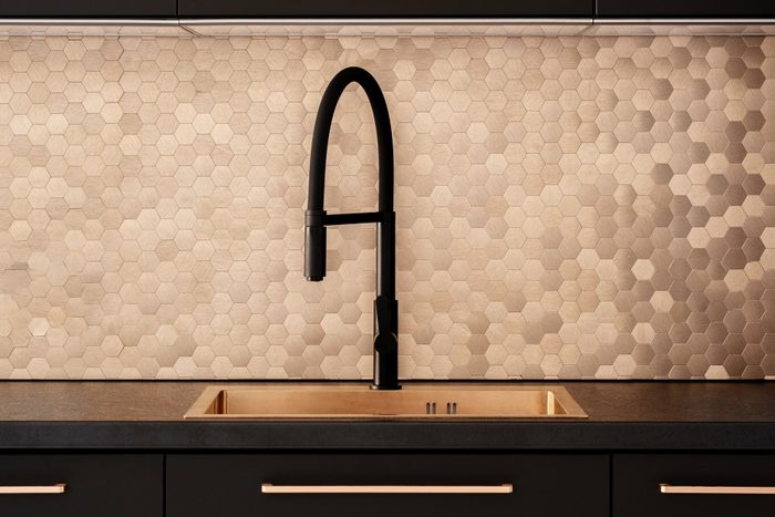 Kitchen In Black And Copper