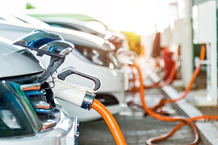 Electric cars charging at EV station