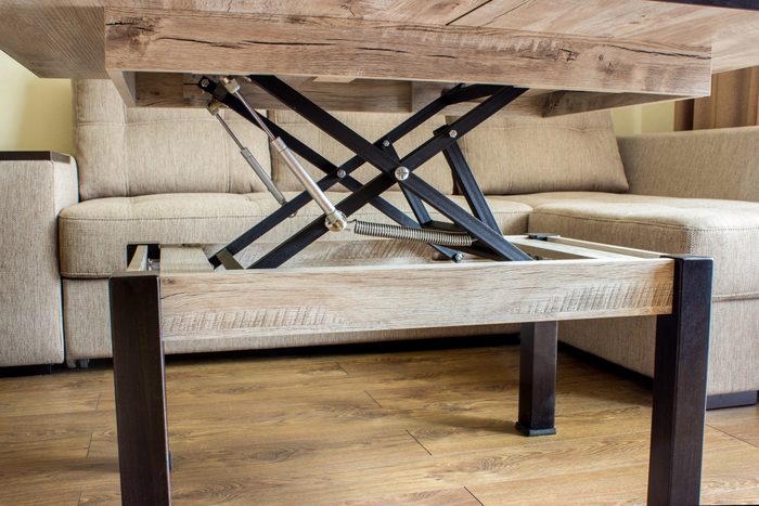 coffee table in a living room raising to desk level