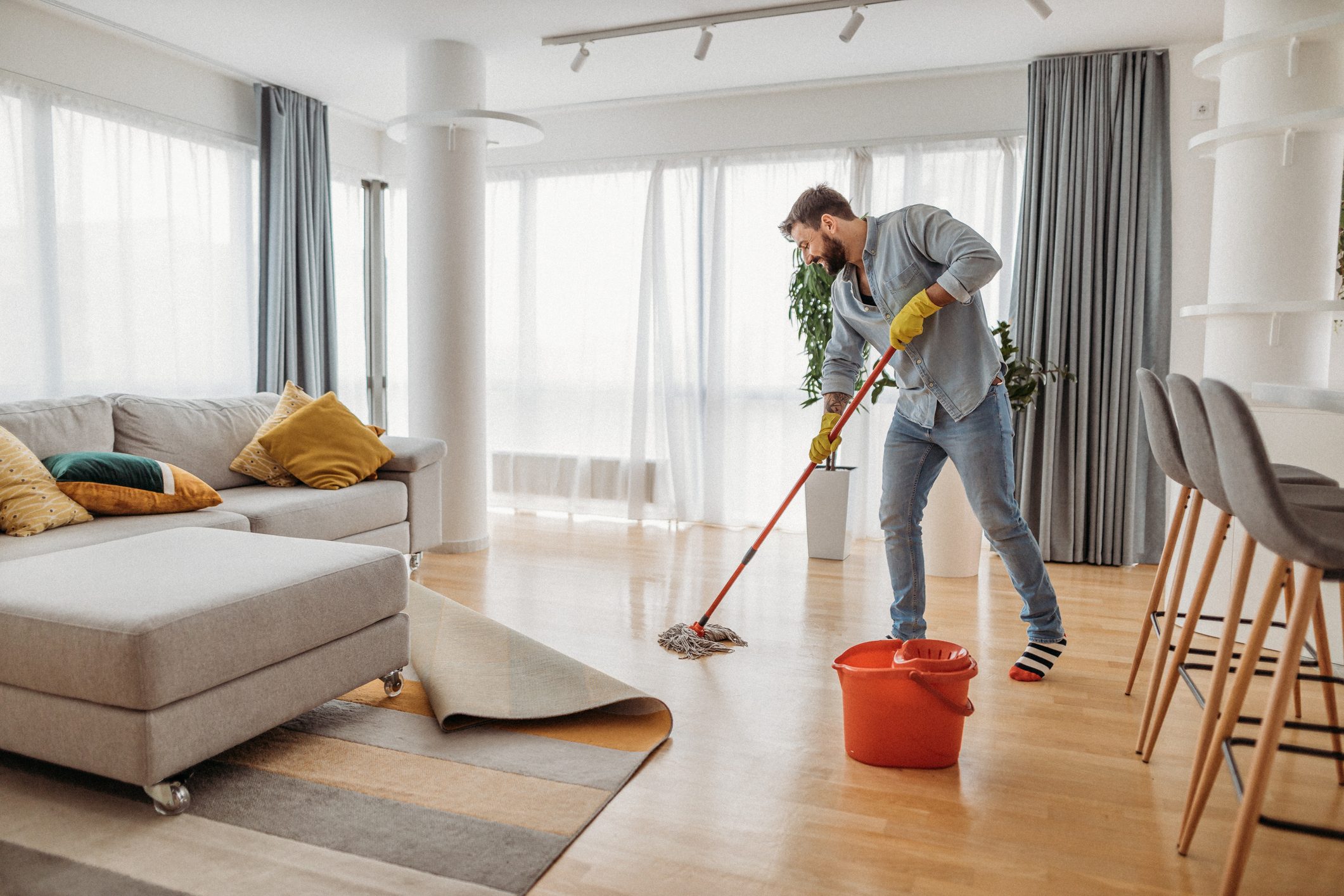 man cleaning in apartment