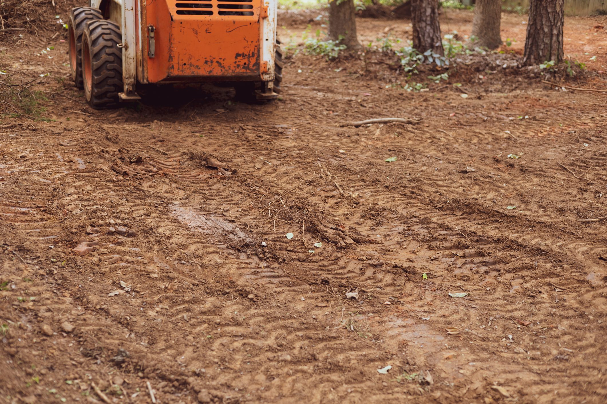 skid steer loader used for earth moving landscaping on recently cleared land