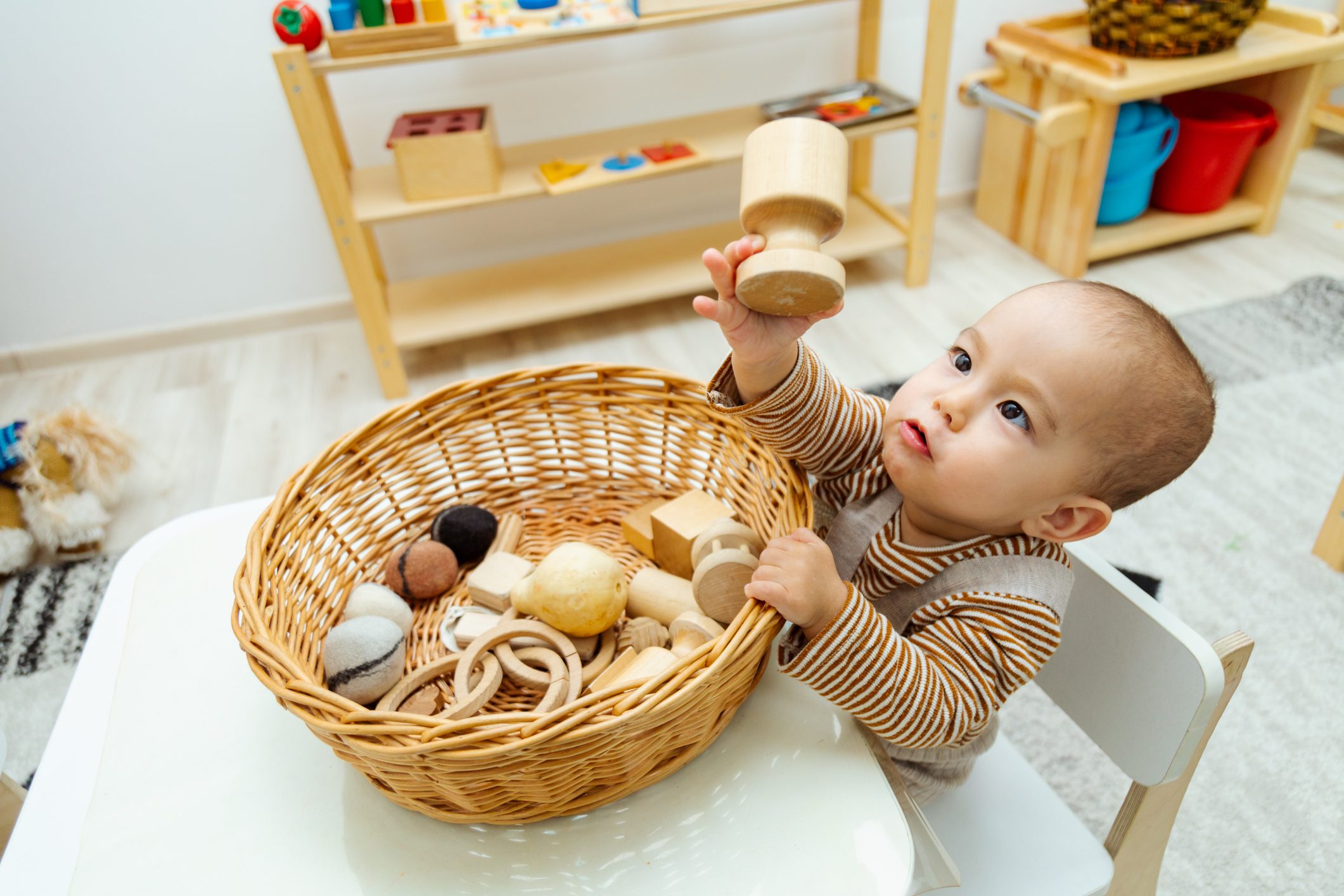 Toddler playing with montessori toys