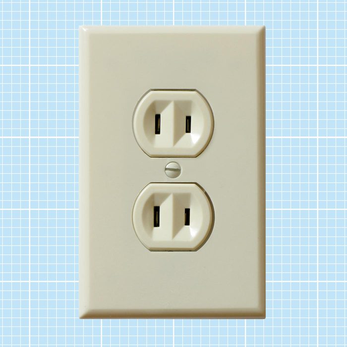Ungrounded Outlet on a blue grid background