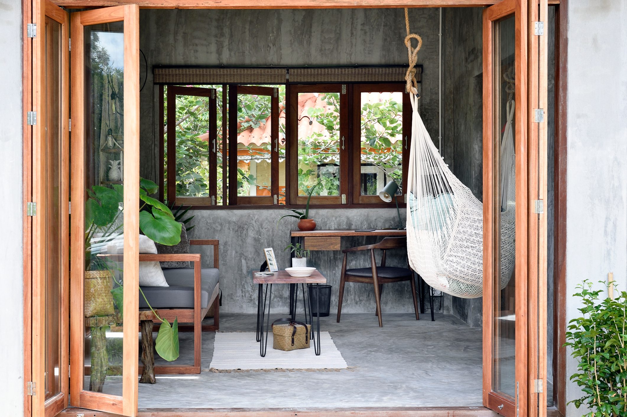 Looking in to a stylish living room through accordian doors