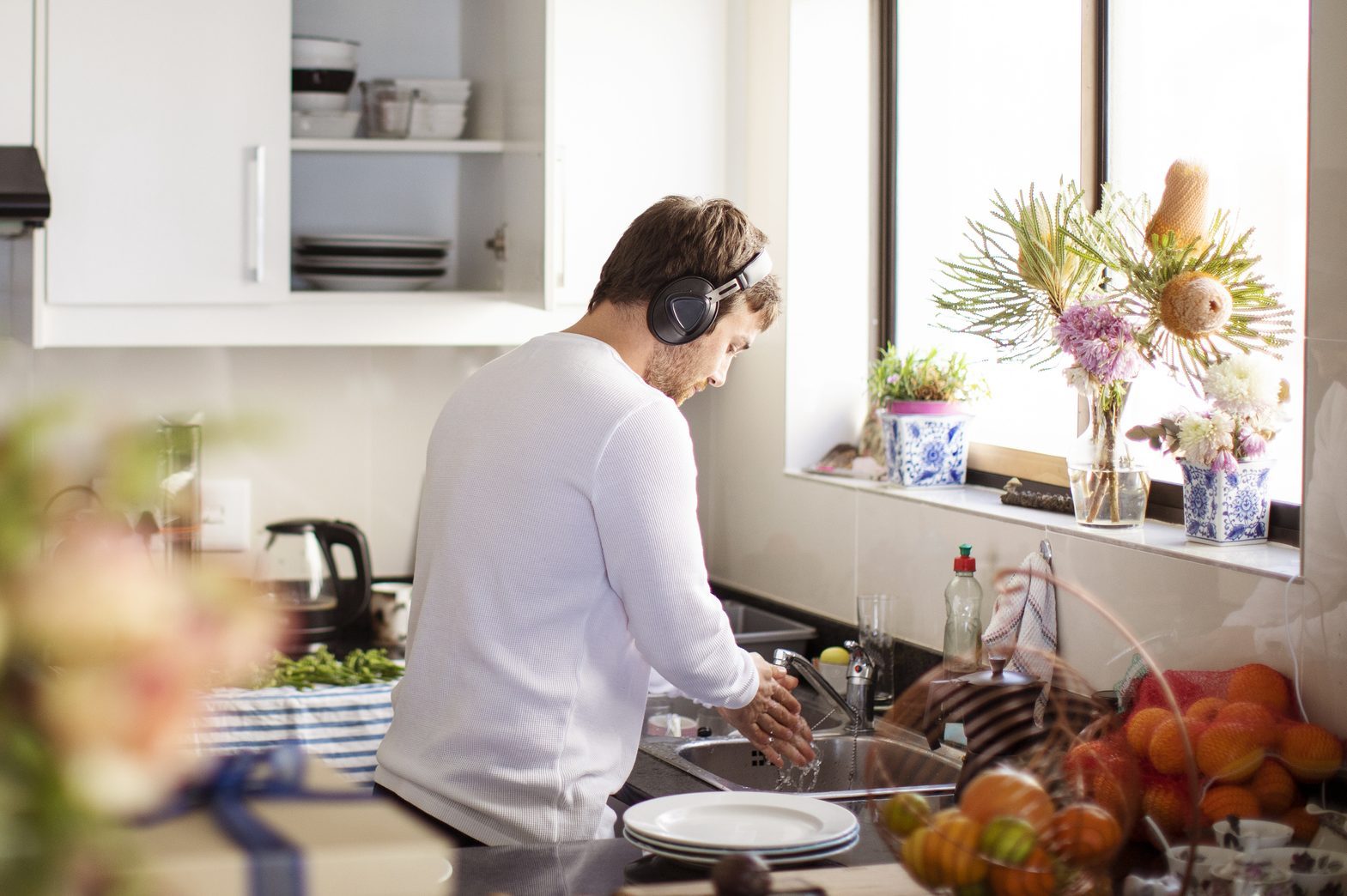 Adult man preparing food in the kitchen.