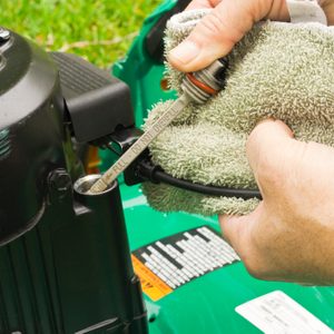 checking oil on a lawn mower