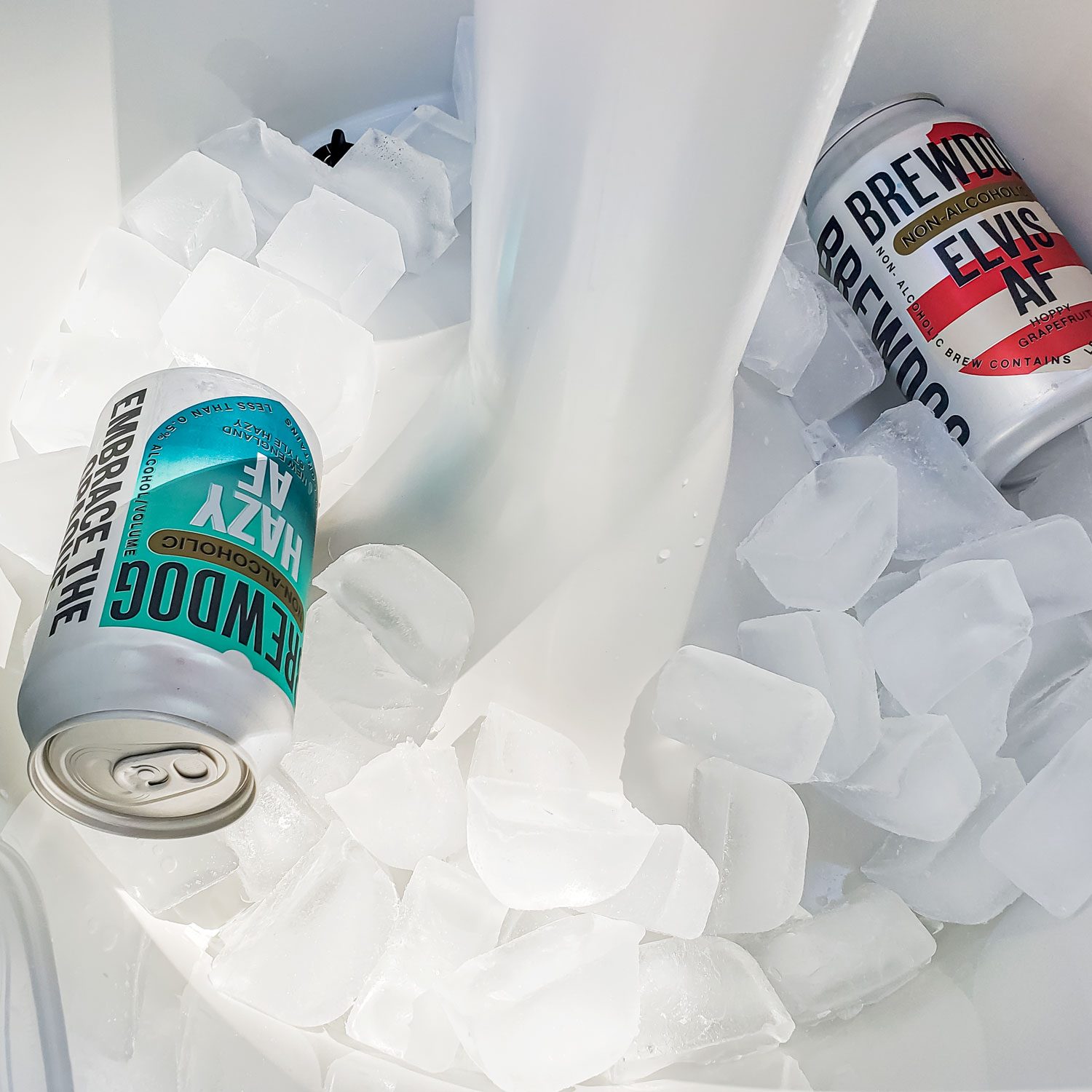 Ice Cubes and Beverages Cans Inside of Keter Outdoor Bar Table