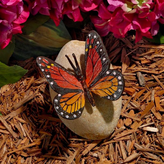 Ulysses Butterfly On A Rock Statue